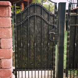 A full wrought iron gate - a cottage