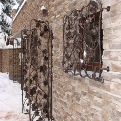 Artistic wrought iron grilles in a wine cellar